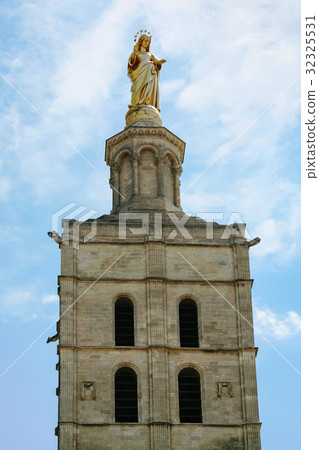 golden statue on top of cathedral tower in Avignon 32325531
