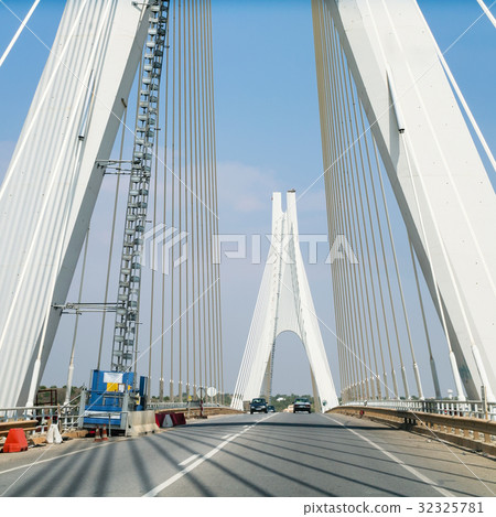 road on cable-stayed bridge near Portimao city road on cable-stayed bridge near Portimao city 32325781