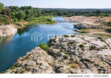 riverbank of of Gardon River near Pont du Gard riverbank of of Gardon River near Pont du Gard 32325800