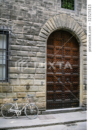 bicycle near door of medieval house in Florence bicycle near door of medieval house in Florence 32325815