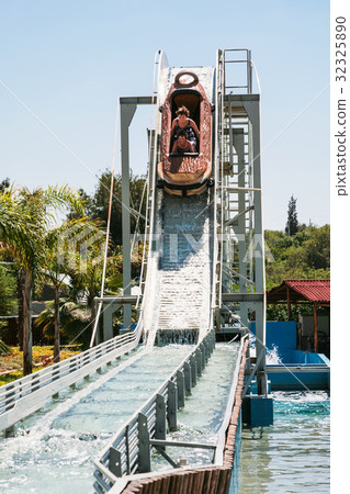girls in boat on water slide attraction girls in boat on water slide attraction 32325890