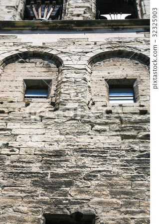 stone wall of medieval palace in Avignon city 32325903