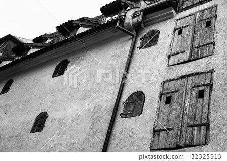 wall of medieval house with wooden blinds in Riga wall of medieval house with wooden blinds in Riga 32325913