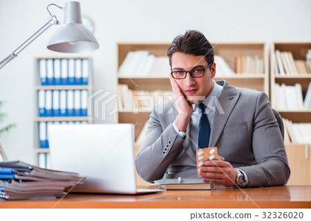Sick businessman in the office Sick businessman in the office 32326020