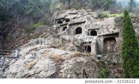 caves in slope of West Hill in Longmen 32326122