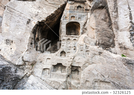 reliefs and caves in wall of West Hill in Longmen 32326125