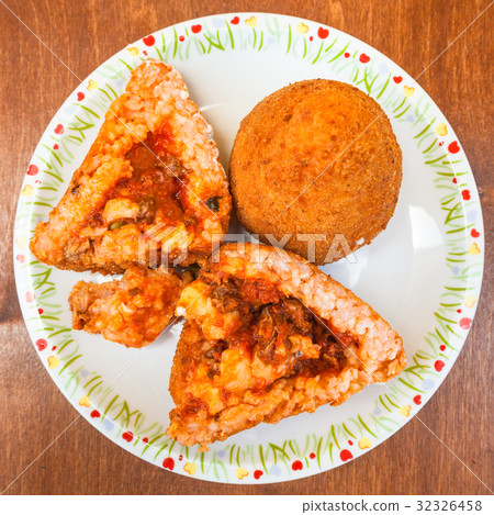 top view of meat ragu stuffed rice balls arancini 32326458