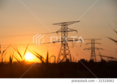 Transmission power line silhouette on sunset 32328062