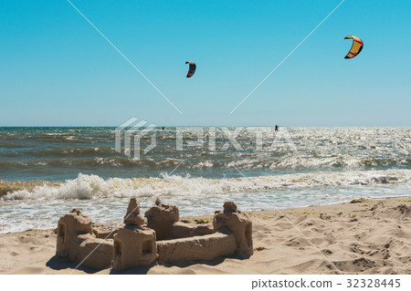 Two kitesurfs in the sea against the blue sky 32328445