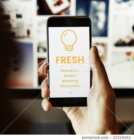 Hand working on digital device network graphic overlay 32329262