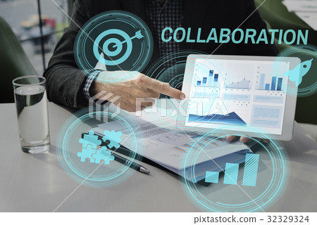 Hands working on digital device network graphic overlay Hands working on digital device network graphic overlay 32329324