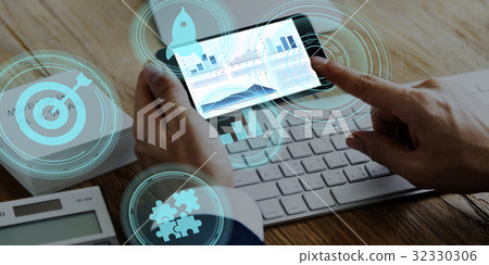 Hands working on digital device network graphic overlay Hands working on digital device network graphic overlay 32330306