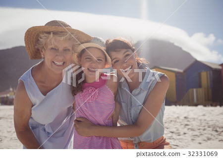 Portrait of smiling multi-generation family at beach 32331069