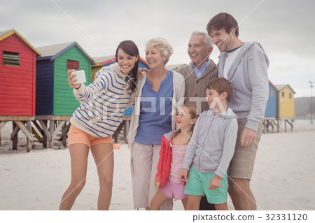 Cheerful multi-generation family taking selfie 32331120