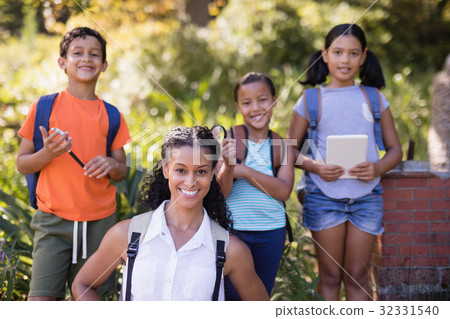 Portrait of happy teacher and students 32331540