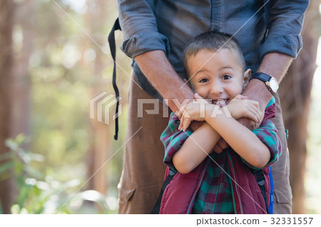 Portrait of playful boy with father Portrait of playful boy with father 32331557