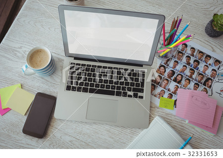 High angle view of desk in creative office High angle view of desk in creative office 32331653