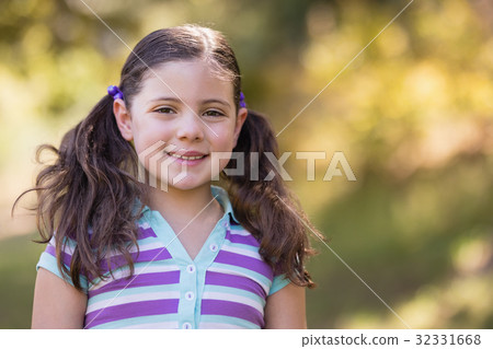 Portrait of cute girl on sunny day 32331668