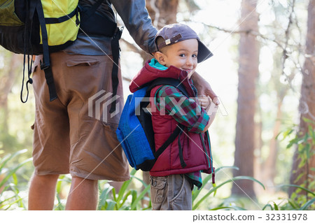 Portrait of happy boy holding hands with father 32331978