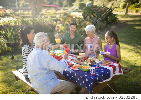 Family having meal in the park Family having meal in the park 32332285