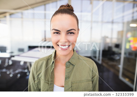 Portrait of businesswoman smiling in office 32333399