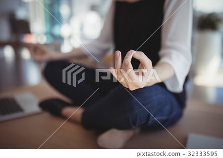 Close-up of executive meditating on desk 32333595