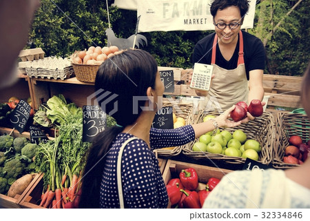 Greengrocer selling organic fresh agricultural product at farmer 32334846