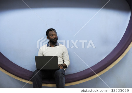 Man working on laptop networking technology Man working on laptop networking technology 32335039
