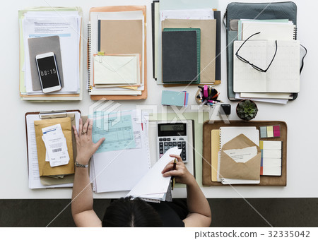 Woman working on the table Woman working on the table 32335042