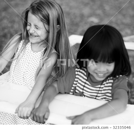 A girl are smiling together A girl are smiling together 32335046