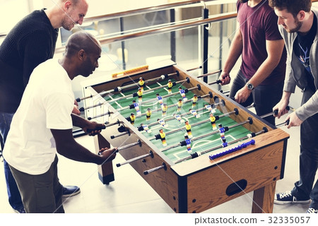 People Playing Enjoying Foosball Table Soccer Game Recreation Le People Playing Enjoying Foosball Table Soccer Game Recreation Le 32335057