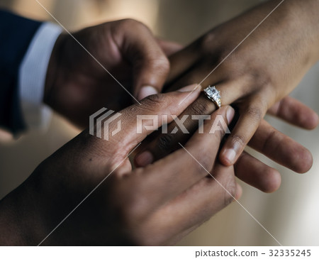 Groom Put on Wedding Ring Bride Hand Groom Put on Wedding Ring Bride Hand 32335245