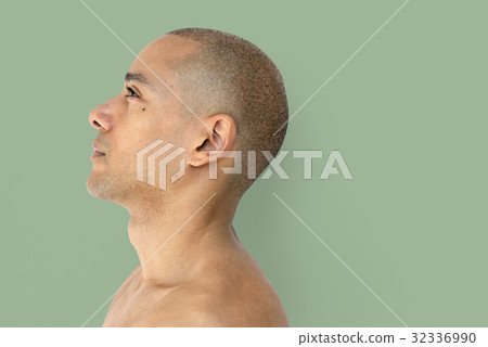 A skinhead guy is in a studio shoot 32336990