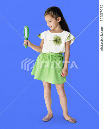 A girl is holding green magnifier A girl is holding green magnifier 32337082
