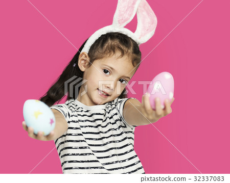 A girl with an easter eggs and bunny hairband A girl with an easter eggs and bunny hairband 32337083