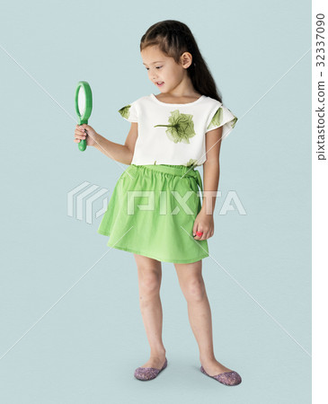 A girl is holding green magnifier A girl is holding green magnifier 32337090