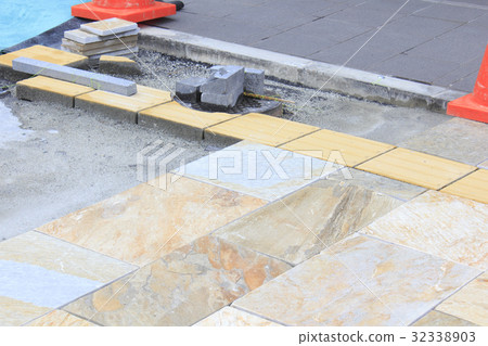 Expansion work on the sidewalk 32338903