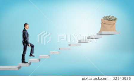 A businessman walking concrete steps made of 32343926