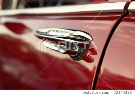 classic retro vintage red car. Car door handle. classic retro vintage red car. Car door handle. 32344356