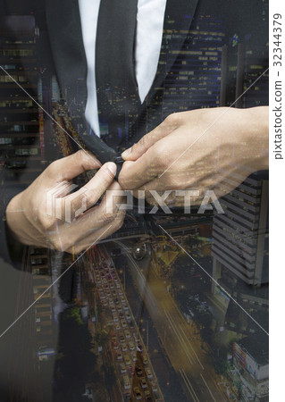 business man buttoning expensive suit jacket 32344379