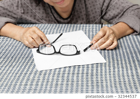 Elderly asian woman repair broken glasses 32344537