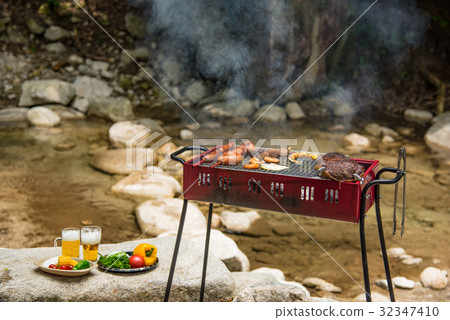 Barbecue at the waterside Char-grilled meat roasted with thick sausages 32347410