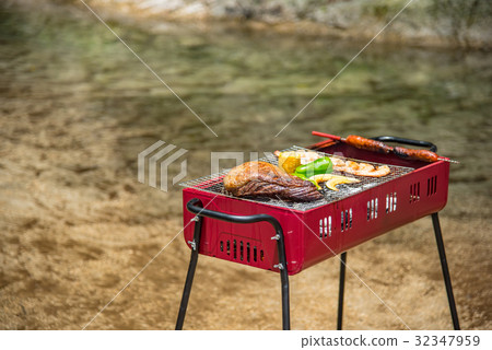 Barbecue at the waterside Char-grilled meat roasted with thick sausages 32347959