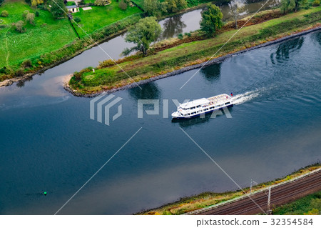 Boat sails on the river from above 32354584