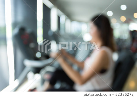 blurred woman cycling burn fat on bicycle cardio blurred woman cycling burn fat on bicycle cardio 32356272