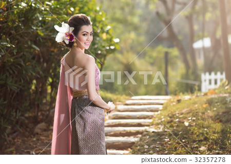 Beautiful Thai girl in Thai traditional costume Beautiful Thai girl in Thai traditional costume 32357278