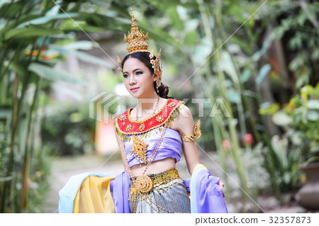 Beautiful Thai girl in Thai traditional costume Beautiful Thai girl in Thai traditional costume 32357873