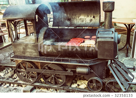 Barbecue grill with meat in shape steam locomotive 32358133
