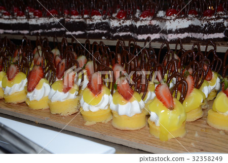 Delicious cream cakes and fruit in the hotel 32358249