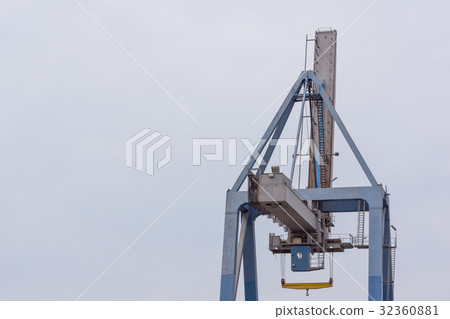 Boy sitting on te edge of a scarp, above the sea Boy sitting on te edge of a scarp, above the sea 32360881